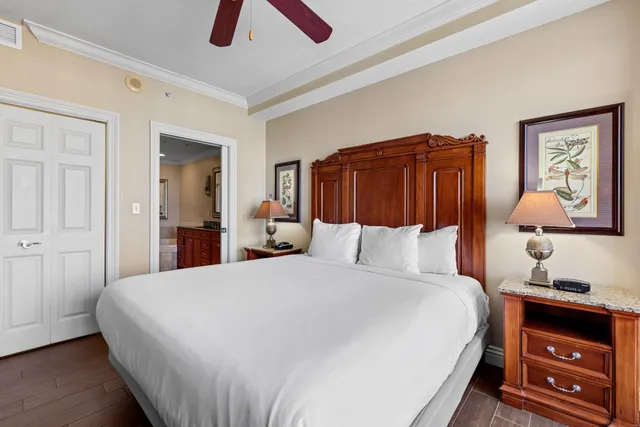 a bathroom with a granite countertop double vanity sink and a large mirror