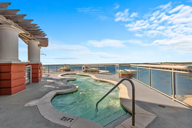 a view of swimming pool with seating space