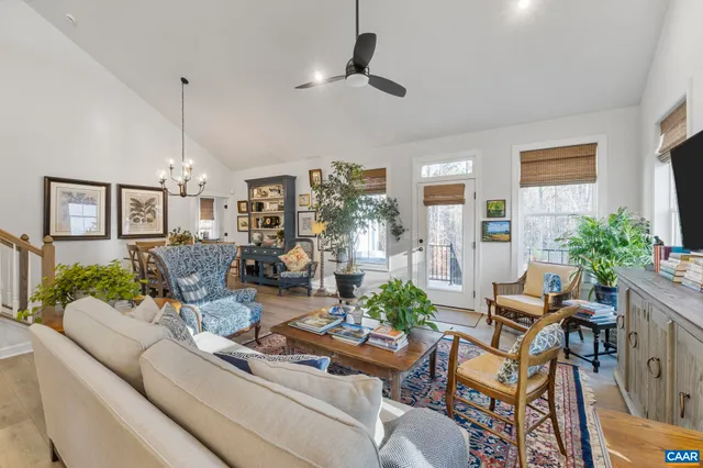 a living room with furniture chandelier and a chandelier