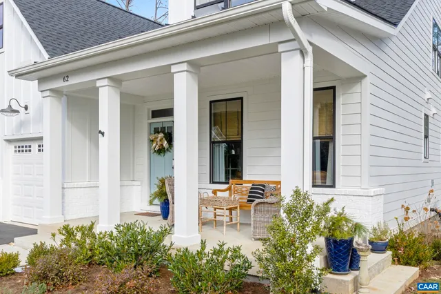front view of a house with table and chairs