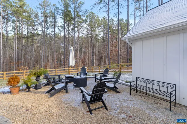 a view of swimming pool with outdoor seating