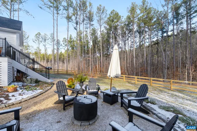 swimming pool view with a seating space