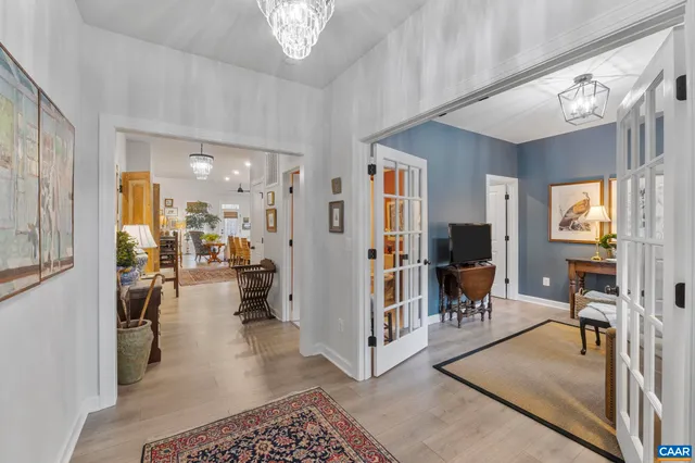 a dining room with furniture and a flat screen tv