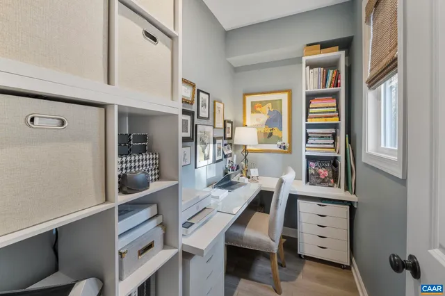 a room with furniture a rug and a window