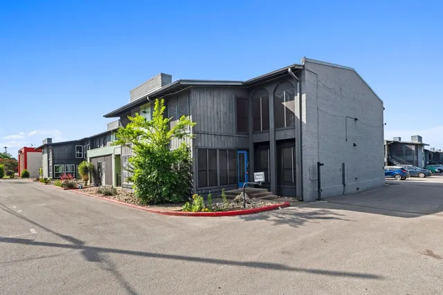 a view of a house with basketball court