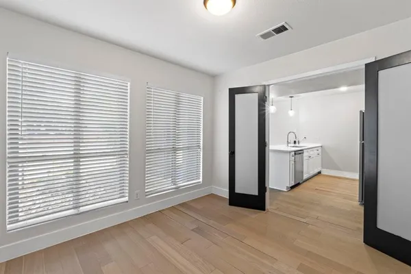 a view of a kitchen with a sink and a window