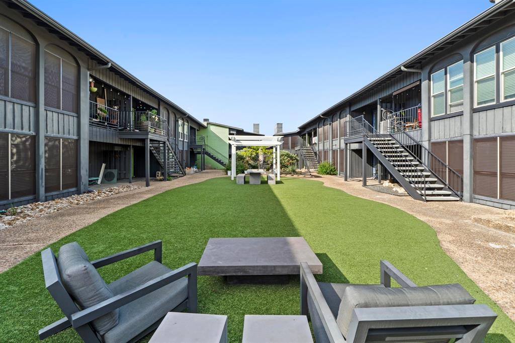 909 Reinli Street, Unit 101 Austin, TX 78751 - Photo 28 of 34 a view of a backyard with sitting area