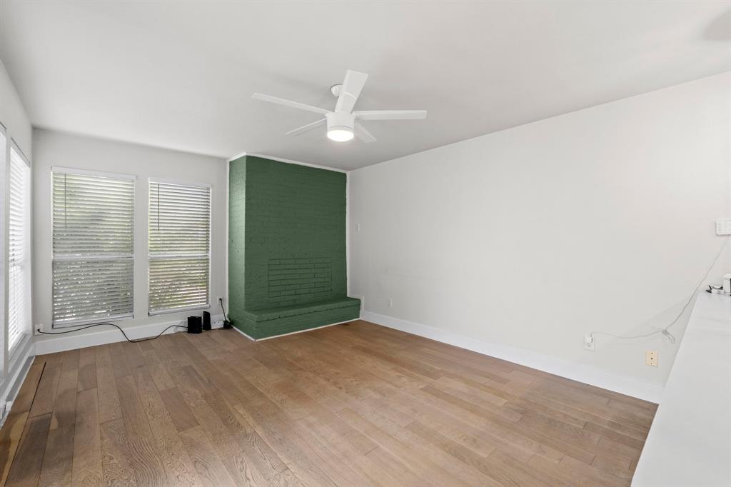 909 Reinli Street, Unit 101 Austin, TX 78751 - Photo 29 of 34 wooden floor in an empty room with a window