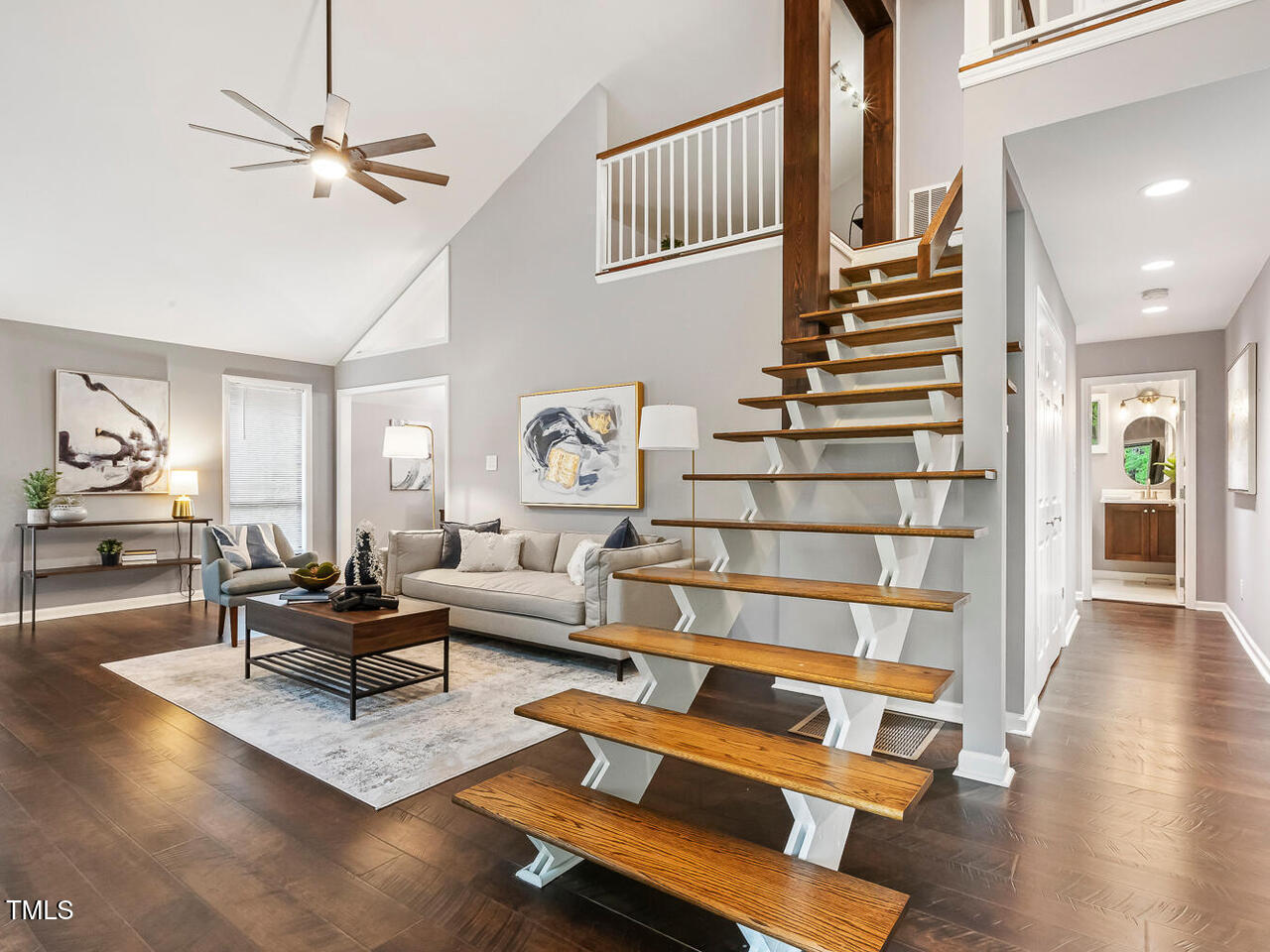 3900 Maplefield Drive Raleigh, NC 27613 - Photo 9 of 58 a living room with furniture wooden floor and a table