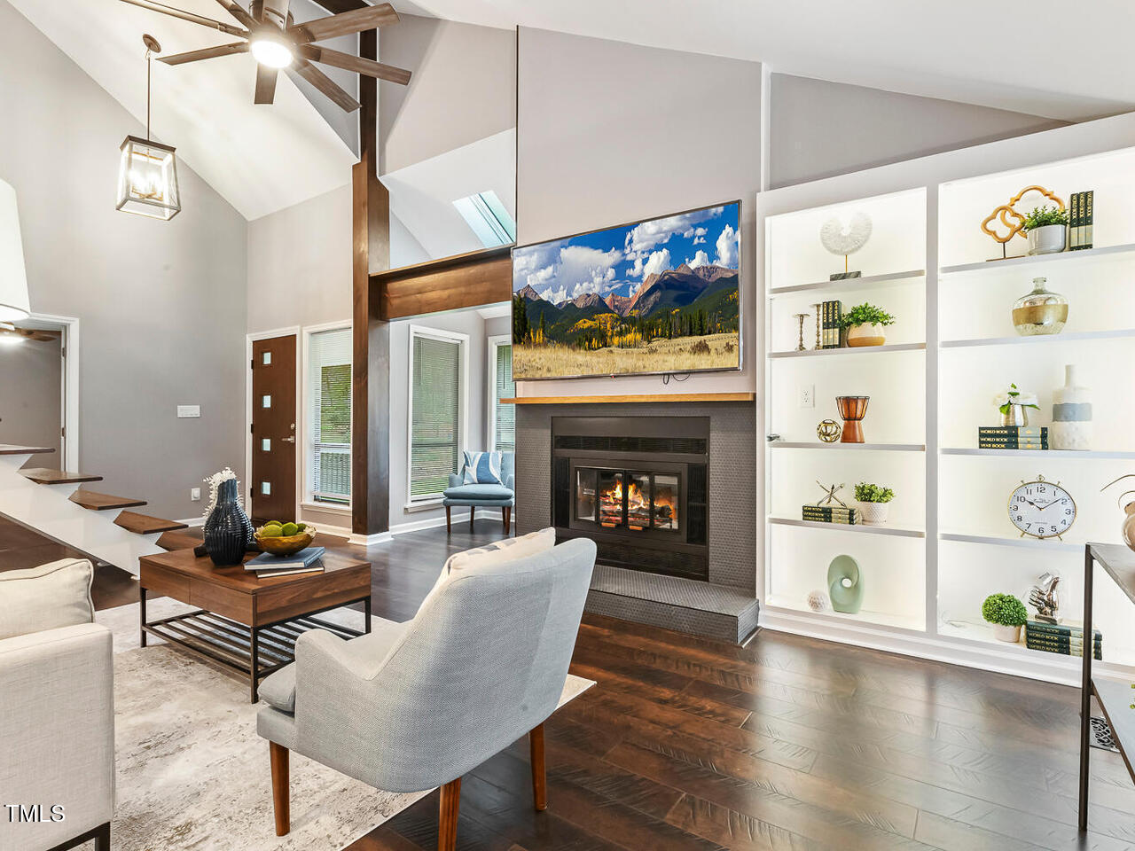 3900 Maplefield Drive Raleigh, NC 27613 - Photo 15 of 58 a living room with furniture fireplace and flat screen tv
