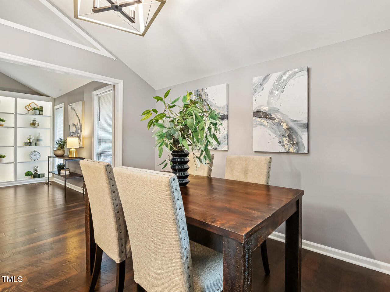 3900 Maplefield Drive Raleigh, NC 27613 - Photo 19 of 58 a view of a dining room with furniture and wooden floor