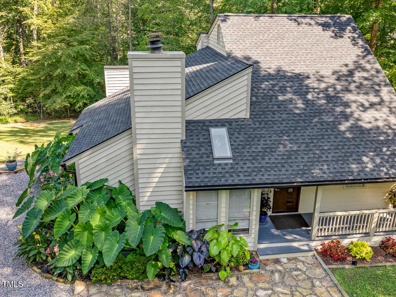 3900 Maplefield Drive Raleigh, NC 27613 - Photo 2 of 58 a front view of a house with garden