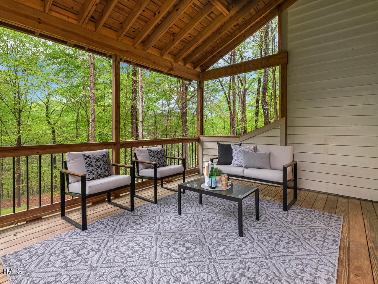 3900 Maplefield Drive Raleigh, NC 27613 - Photo 29 of 58 a view of a chairs and table in the balcony