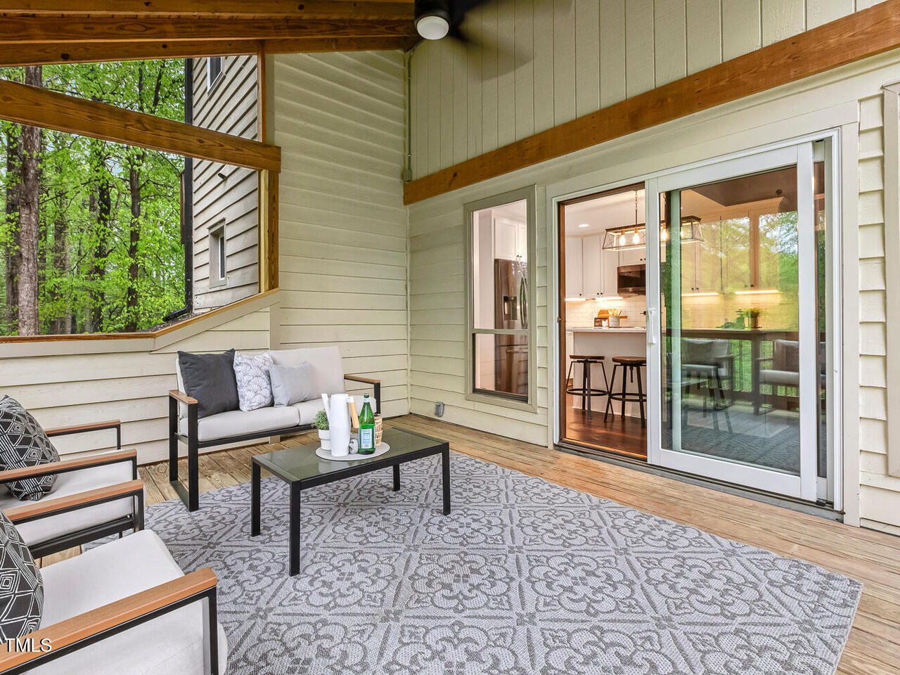 3900 Maplefield Drive Raleigh, NC 27613 - Photo 30 of 58 a outdoor living space with furniture and a rug