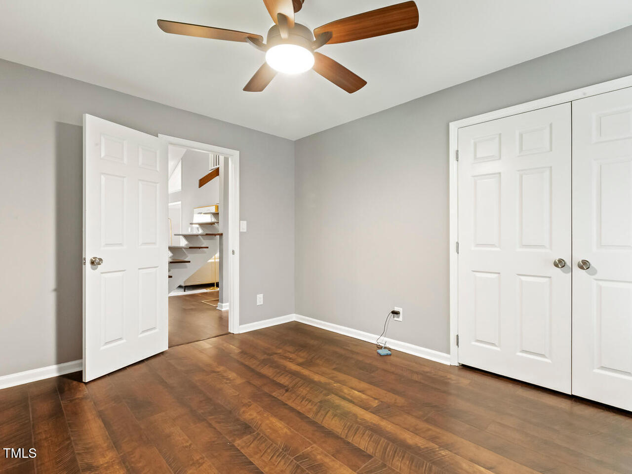 3900 Maplefield Drive Raleigh, NC 27613 - Photo 32 of 58 an empty room with closet and a ceiling fan