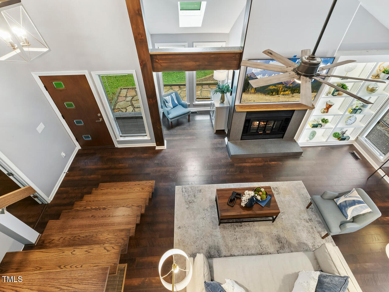 3900 Maplefield Drive Raleigh, NC 27613 - Photo 37 of 58 a living room with furniture and a fireplace