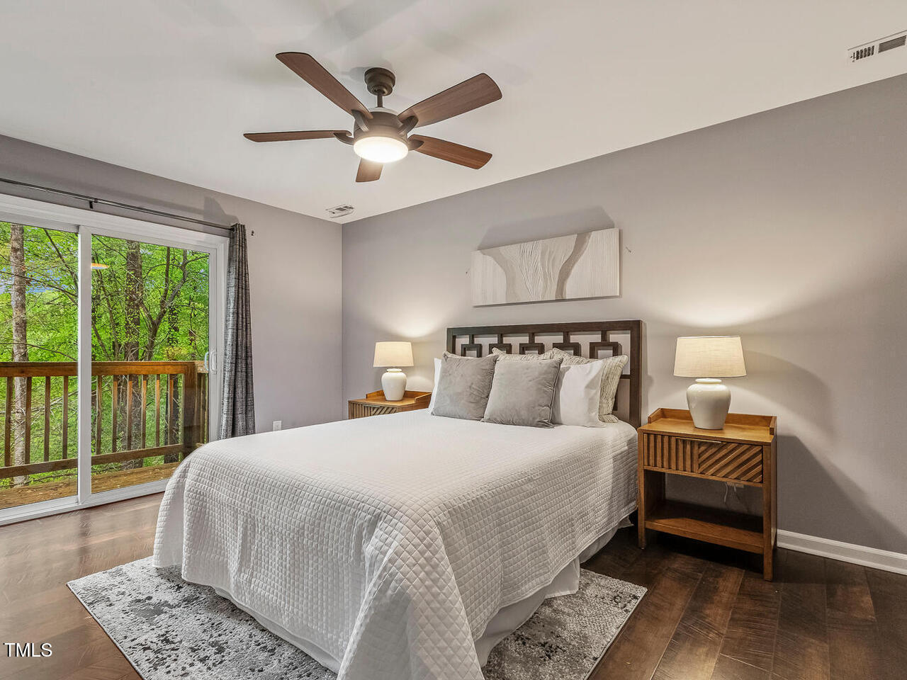 3900 Maplefield Drive Raleigh, NC 27613 - Photo 39 of 58 a bedroom with a large bed and a window