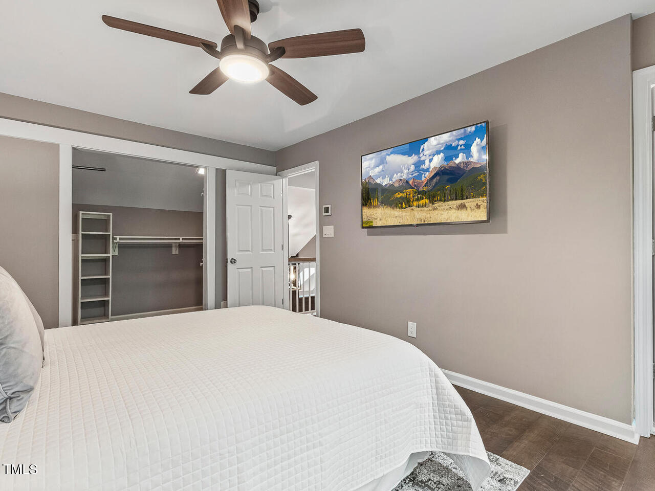 3900 Maplefield Drive Raleigh, NC 27613 - Photo 41 of 58 a bedroom with a bed and a chandelier