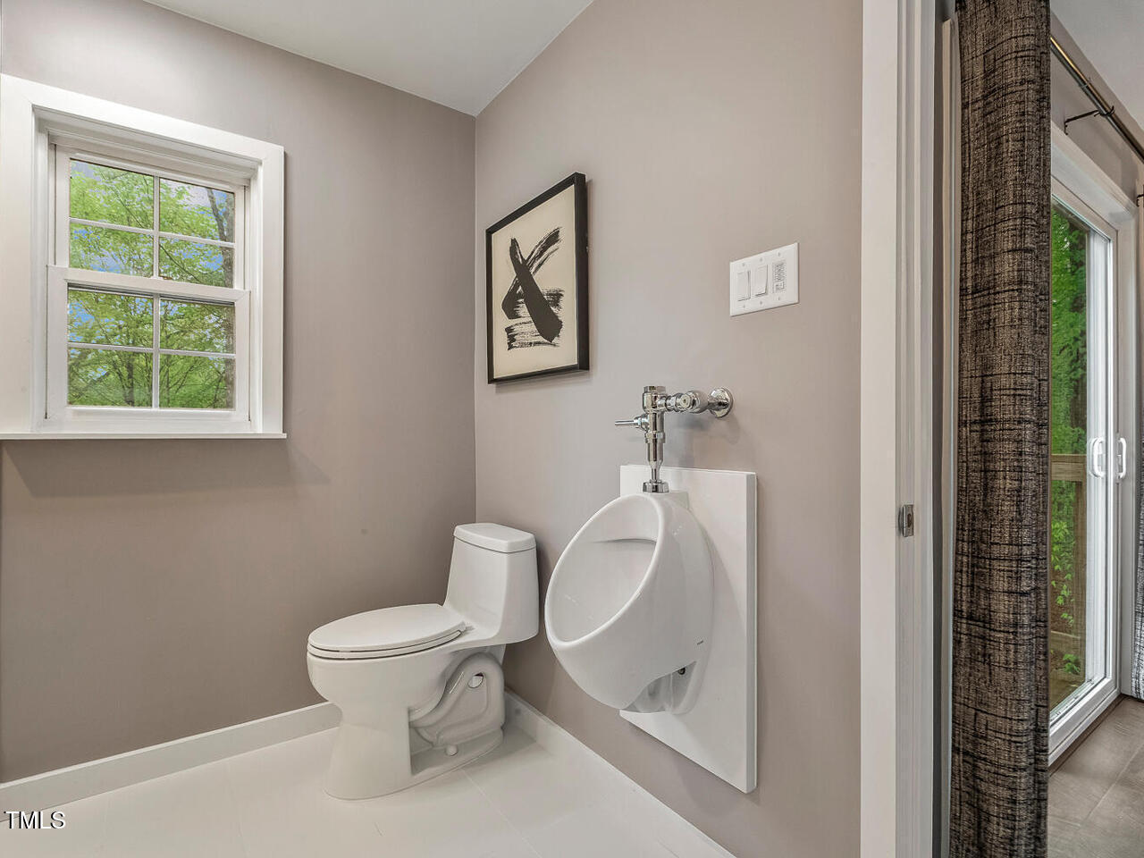 3900 Maplefield Drive Raleigh, NC 27613 - Photo 44 of 58 a white toilet sitting next to a bathroom sink