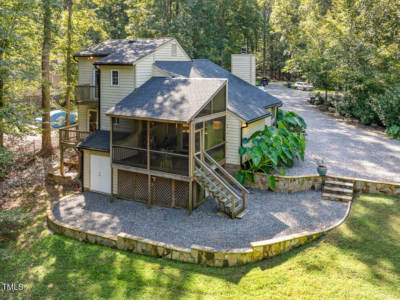 3900 Maplefield Drive Raleigh, NC 27613 - Photo 46 of 58 a view of a house with a yard balcony and sitting area