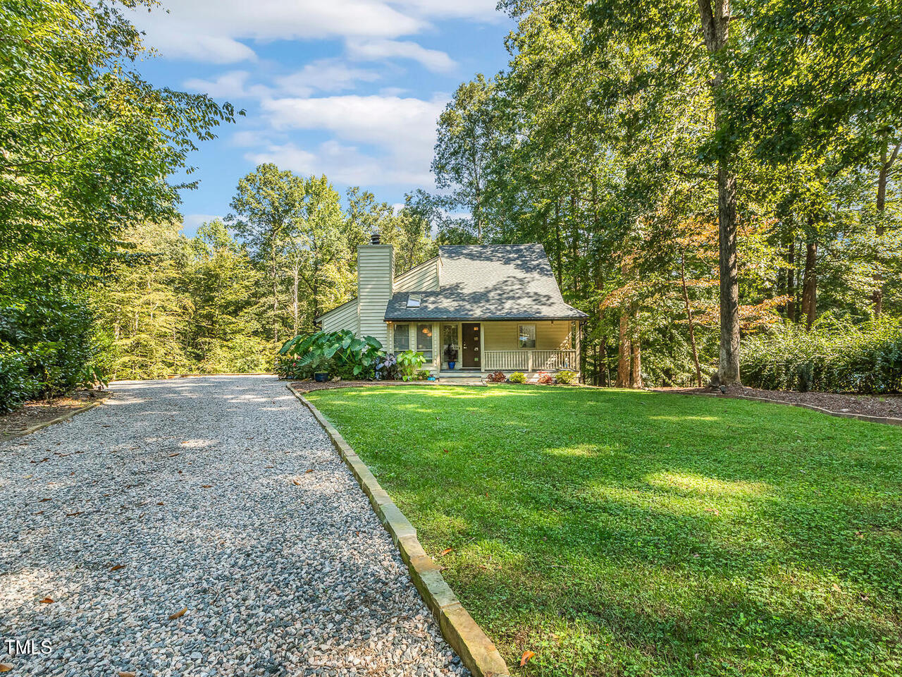 3900 Maplefield Drive Raleigh, NC 27613 - Photo 3 of 58 a front view of a house with a yard
