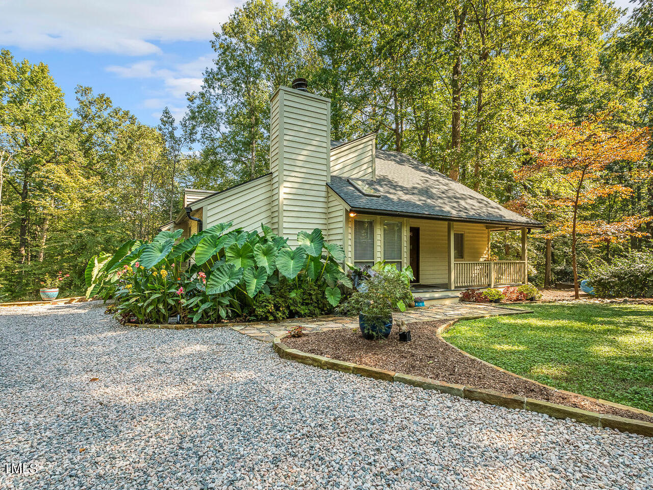 3900 Maplefield Drive Raleigh, NC 27613 - Photo 50 of 58 a front view of a house with garden