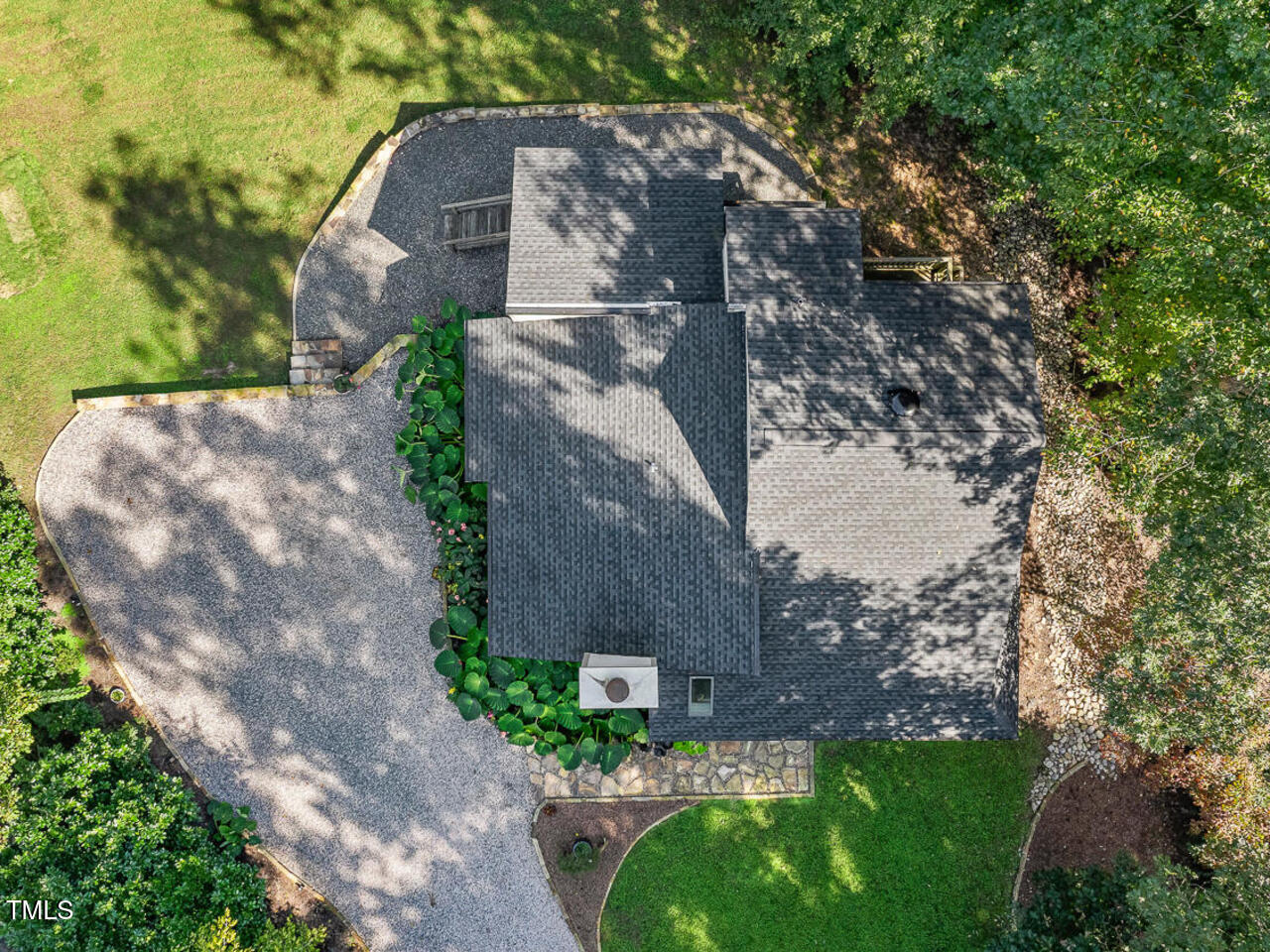 3900 Maplefield Drive Raleigh, NC 27613 - Photo 52 of 58 a backyard of a house with lots of green space