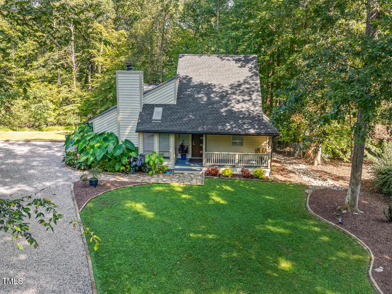3900 Maplefield Drive Raleigh, NC 27613 - Photo 4 of 58 a front view of house with yard and outdoor seating