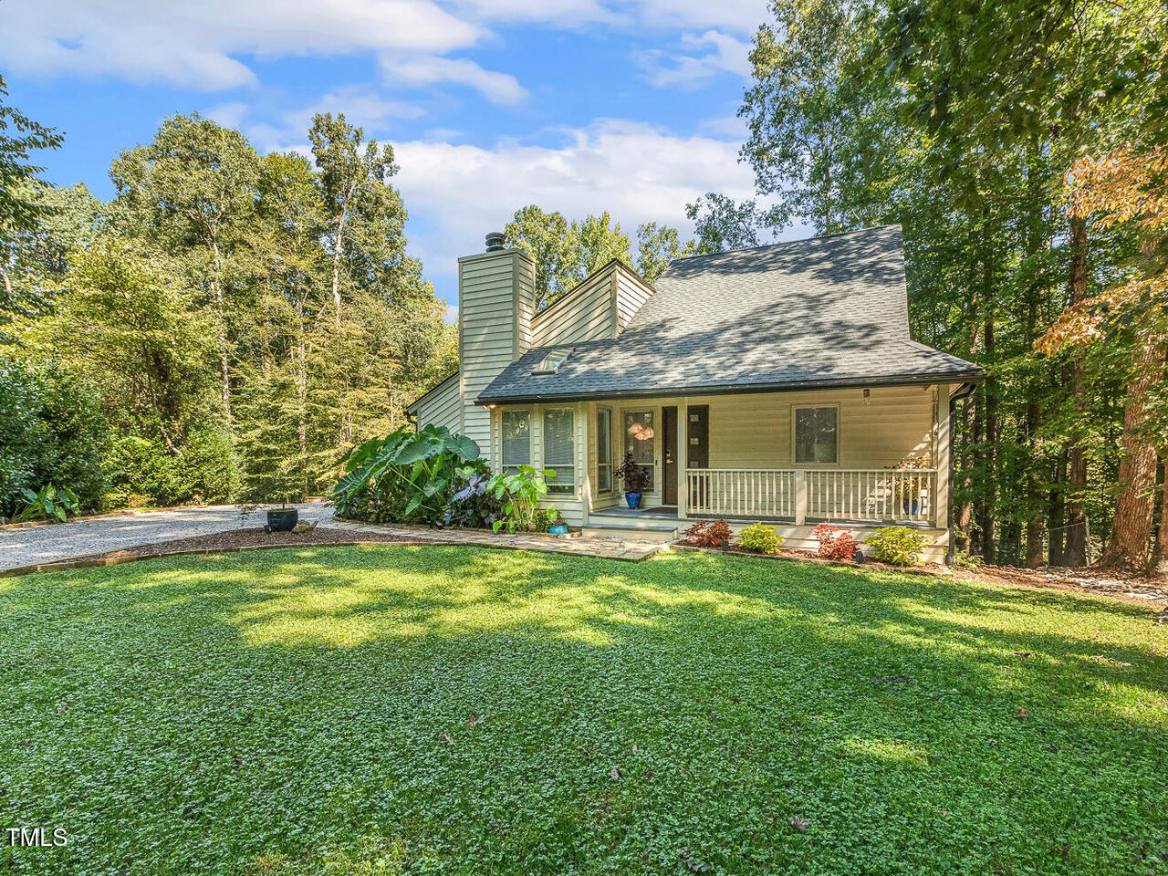 3900 Maplefield Drive Raleigh, NC 27613 - Photo 5 of 58 a view of a house with a yard and sitting area