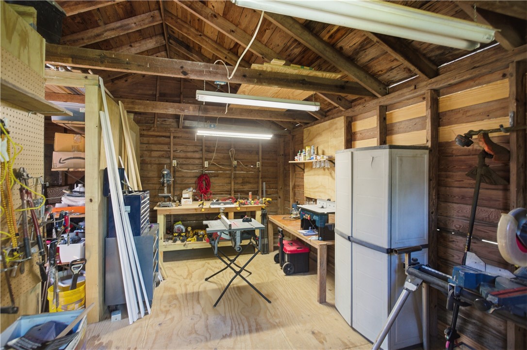 310 Retreat Street Westminster, SC 29693 - Photo 27 of 46 This spacious workshop offers ample room for projects and storage, perfect for creative endeavors.