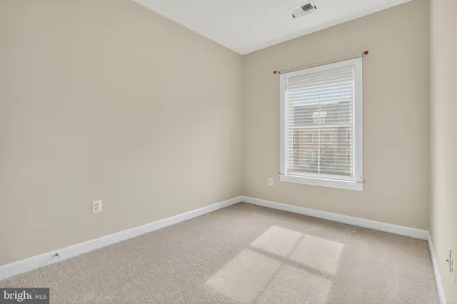 an empty room with closet area