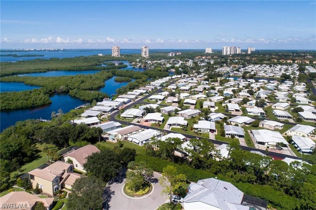 19681 Summerlin Road, Unit F 95 Fort Myers, FL 33908 - Photo 5 of 7 an aerial view of a city with lots of residential buildings lake and mountain view in back