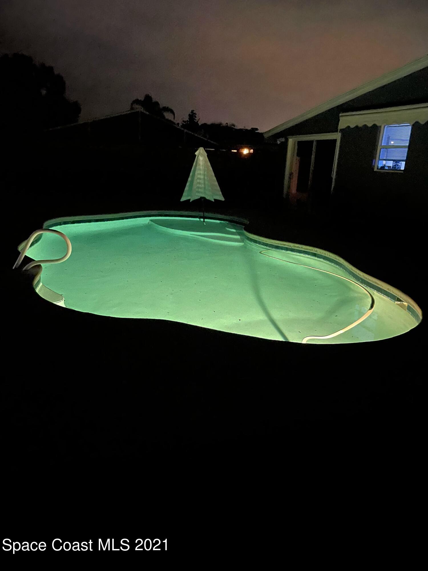 2450 Allan Adale Road Melbourne, FL 32935 - Photo 28 of 29 pool at nght