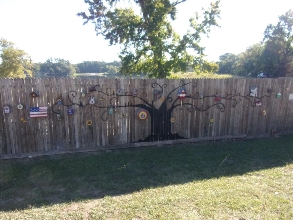 135 Ridgewood Lane Murchison, TX 75778 - Photo 13 of 19 a wooden fence with some trees in the background