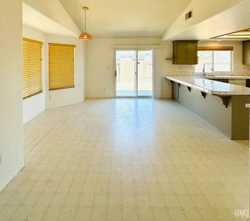 a view of a kitchen with a sink and windows