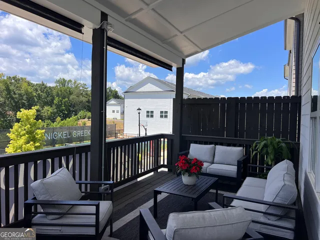 a view of a room with wooden floor and stairs
