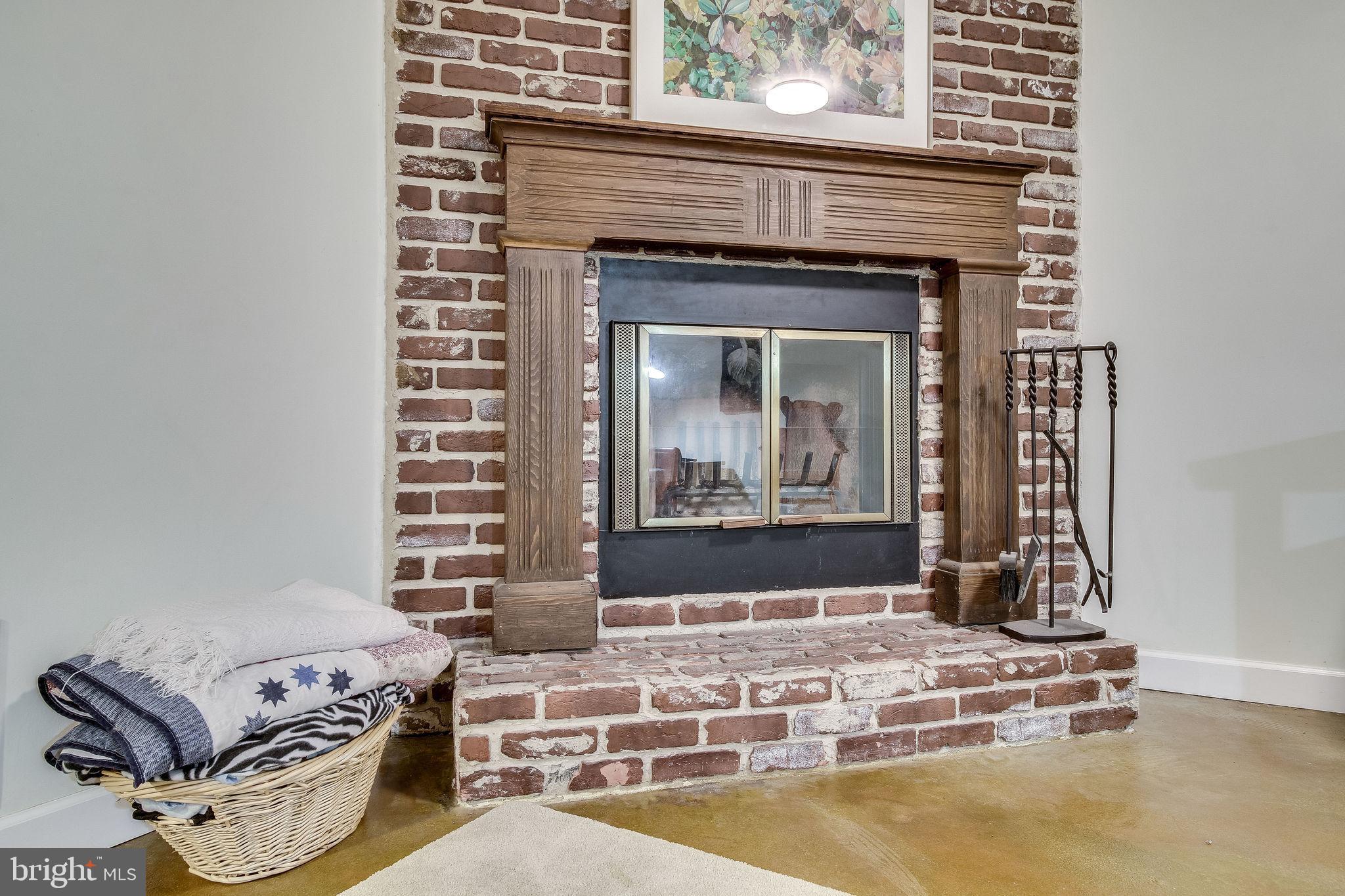 8344 Wickham Road Springfield, VA 22152 - Photo 53 of 72 Wood burning fireplace in basement family room