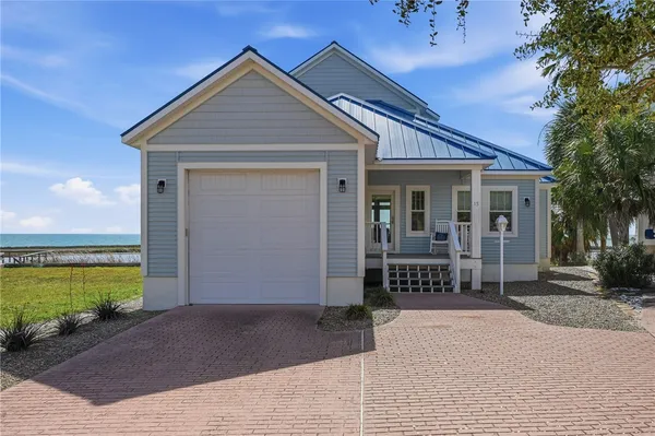 a front view of a house with a outdoor space