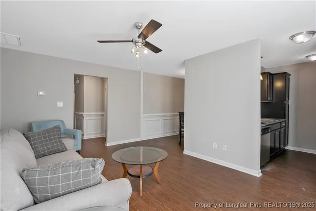 a view of a dining room with furniture and wooden floor