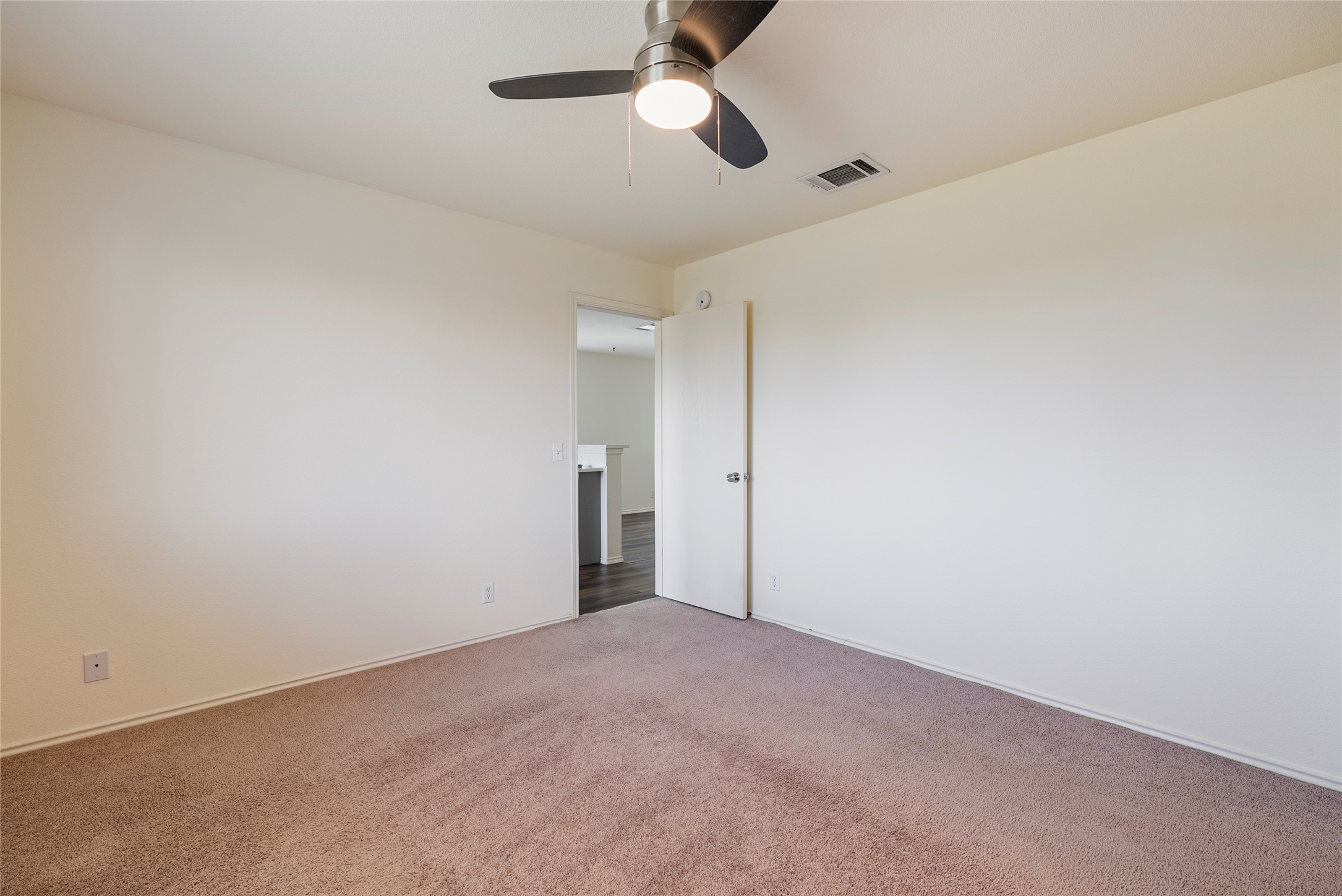 348 Atlantis Kyle, TX 78640 - Photo 13 of 17 Empty room featuring carpet flooring and ceiling fan