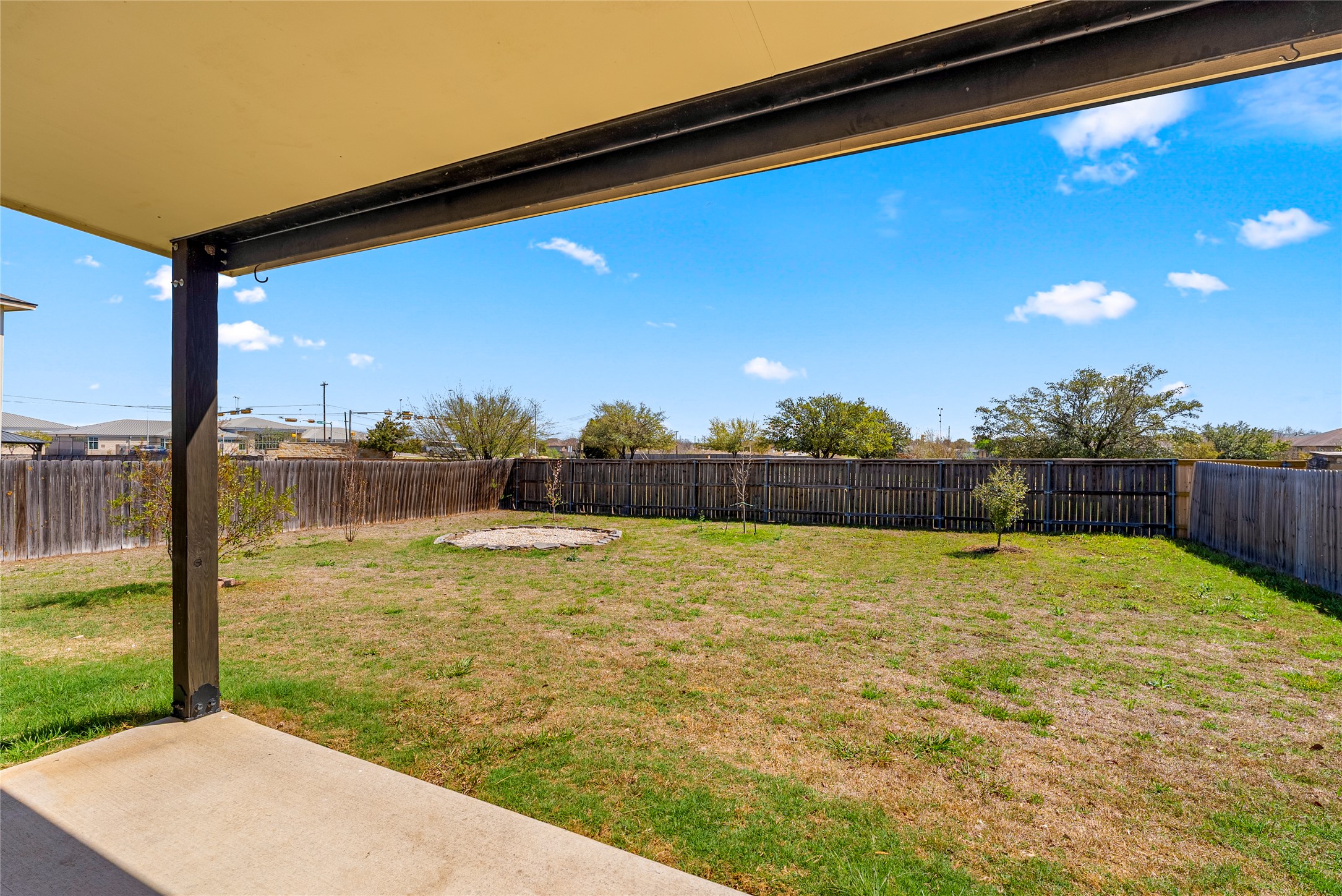 348 Atlantis Kyle, TX 78640 - Photo 17 of 17 Fenced backyard with a patio