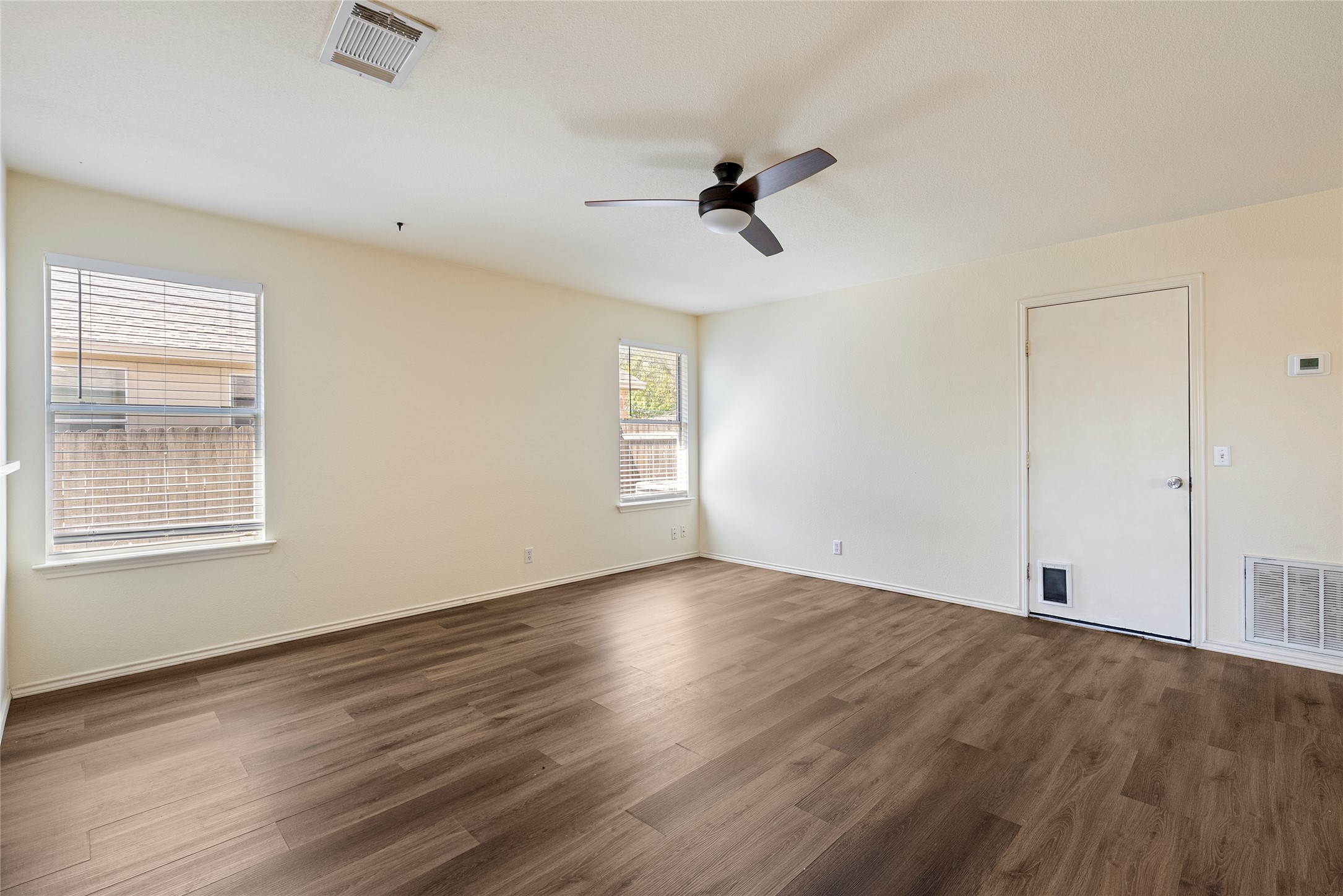 348 Atlantis Kyle, TX 78640 - Photo 3 of 17 Spare room with a ceiling fan and dark wood finished floors