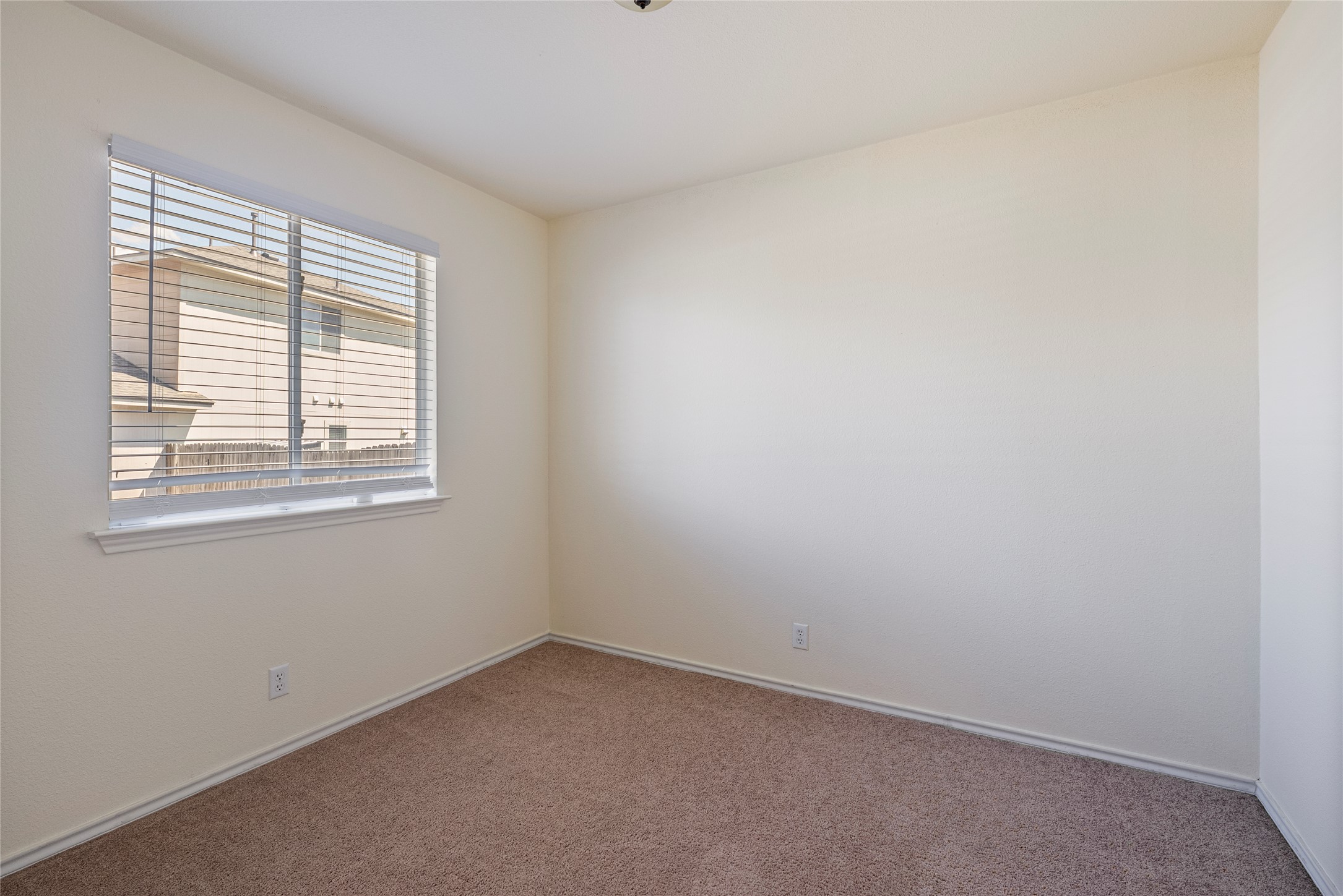 348 Atlantis Kyle, TX 78640 - Photo 7 of 17 Carpeted spare room with baseboards