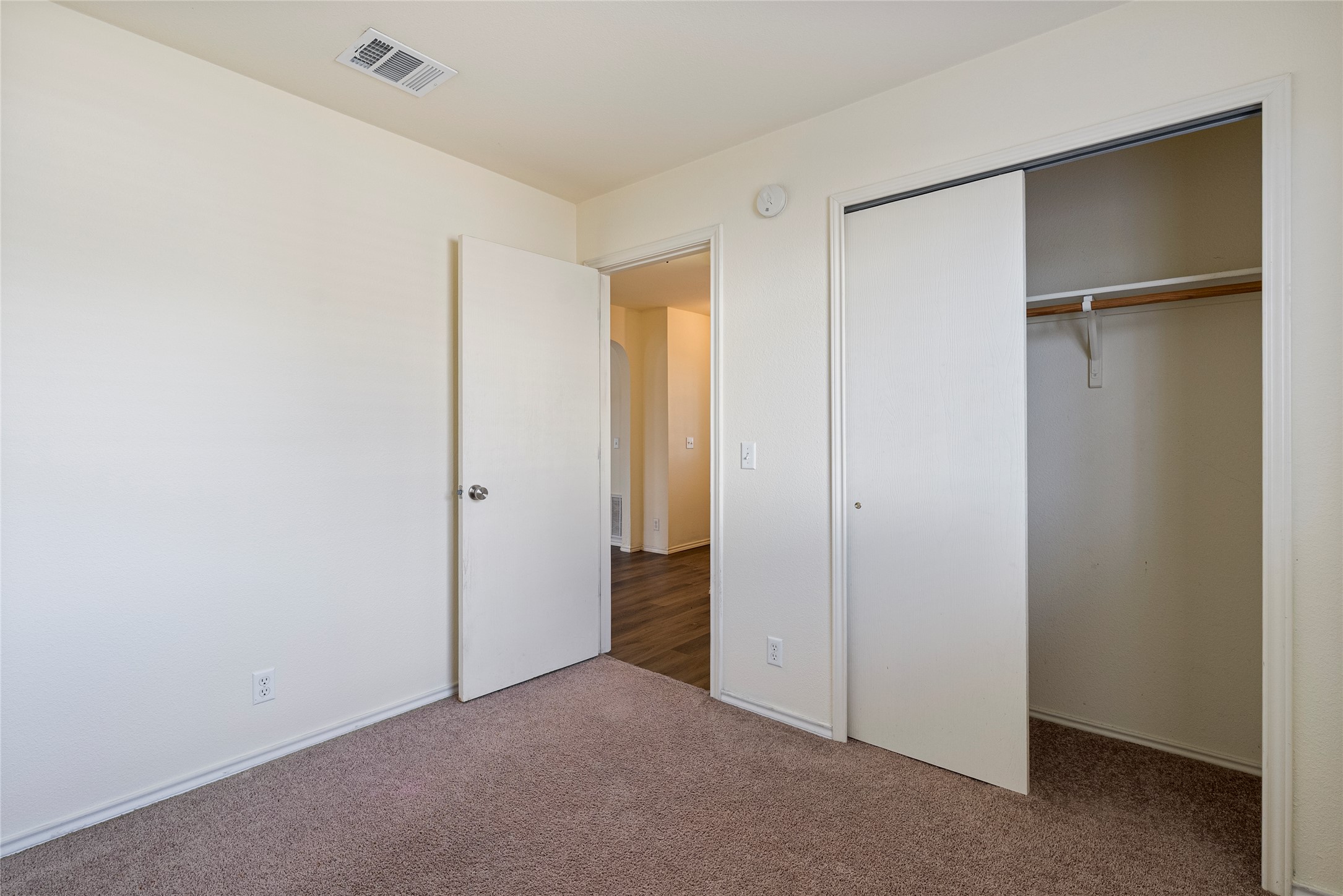 348 Atlantis Kyle, TX 78640 - Photo 8 of 17 Unfurnished bedroom featuring carpet and a closet