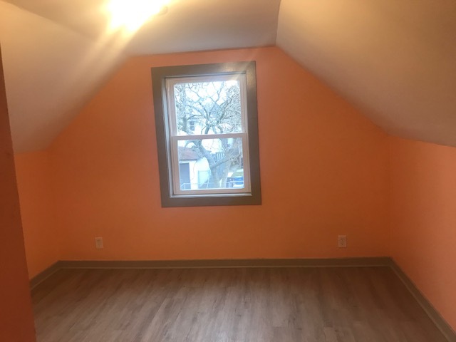 10939 South Normal Avenue Chicago, IL 60628 - Photo 2 of 10 an empty room with a window