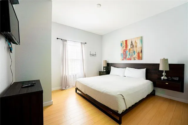 a bedroom with a bed and dresser