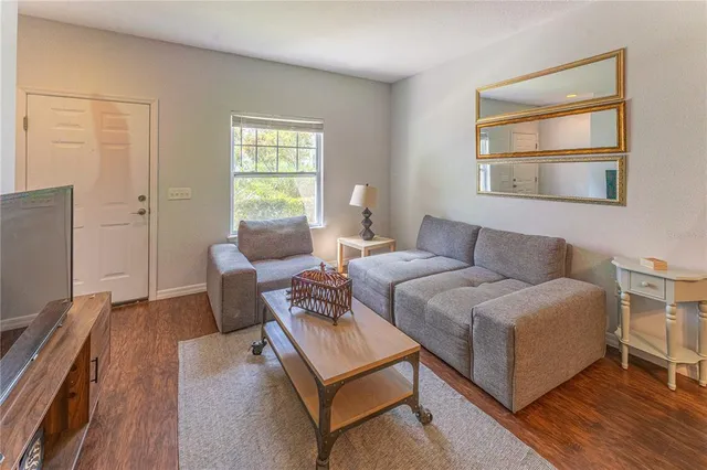 a living room with furniture and a window