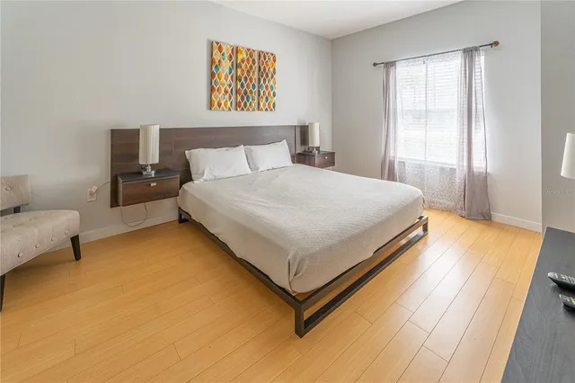 a bedroom with a bed and window