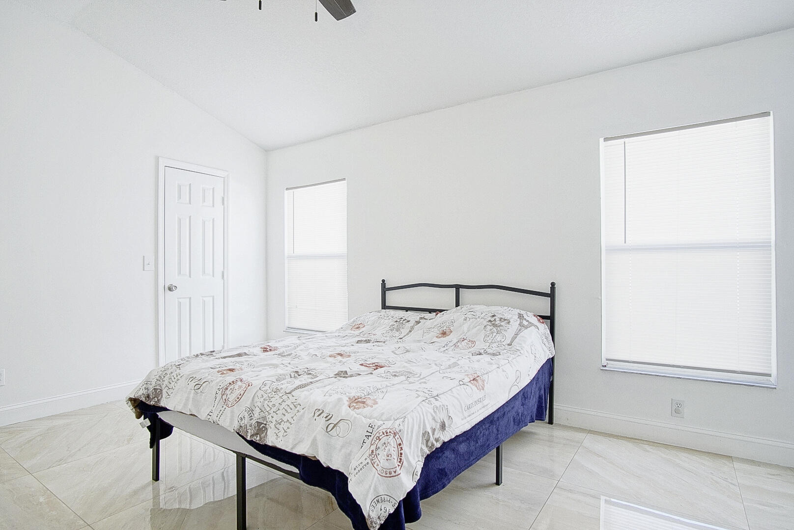 2619 Southwest Fair Isle Road Port St. Lucie, FL 34987 - Photo 12 of 33 a bed sitting in a bedroom next to a window