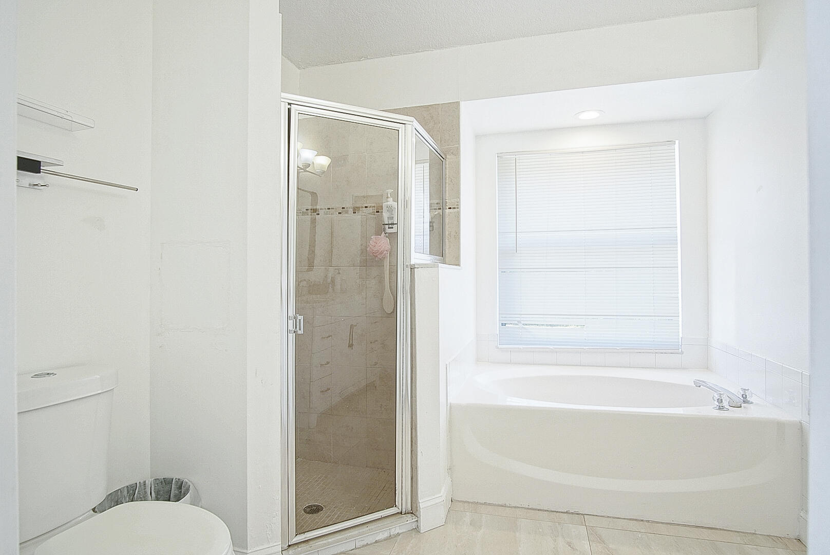 2619 Southwest Fair Isle Road Port St. Lucie, FL 34987 - Photo 13 of 33 a bathroom with a shower and a toilet